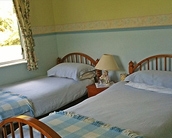 stylish and comfortable queen size bed in 1st bedroom and and twin beds in 2nd room